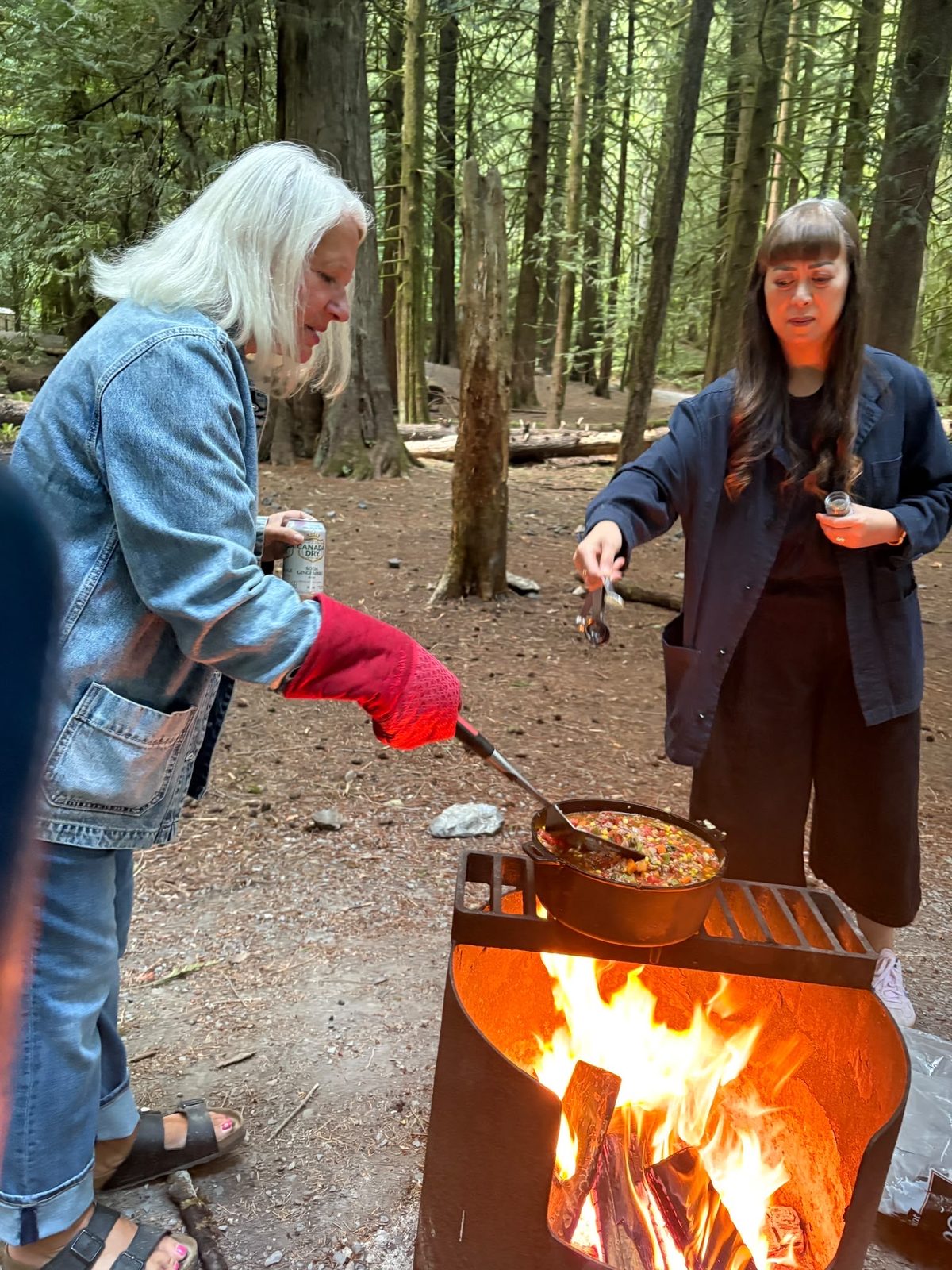 Members cooking homemade chili over the campfire at Goldstream Provincial Park, September 2026